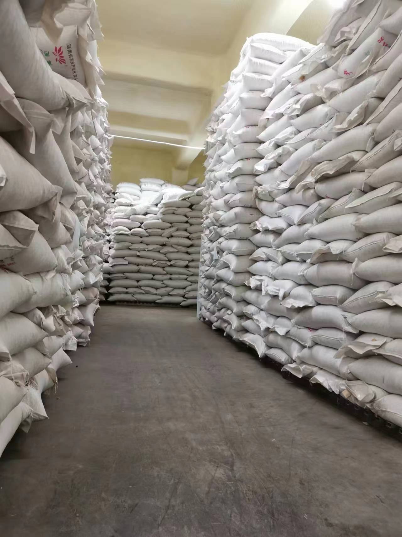 Finished goods warehouse with stacked 25 kg lotus seed bags