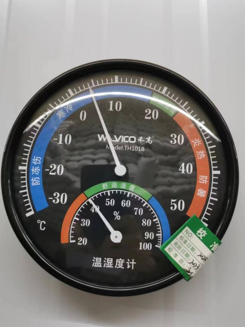 Warehouse thermo-hygrometer reading 23 degrees Celsius and 62 percent relative humidity